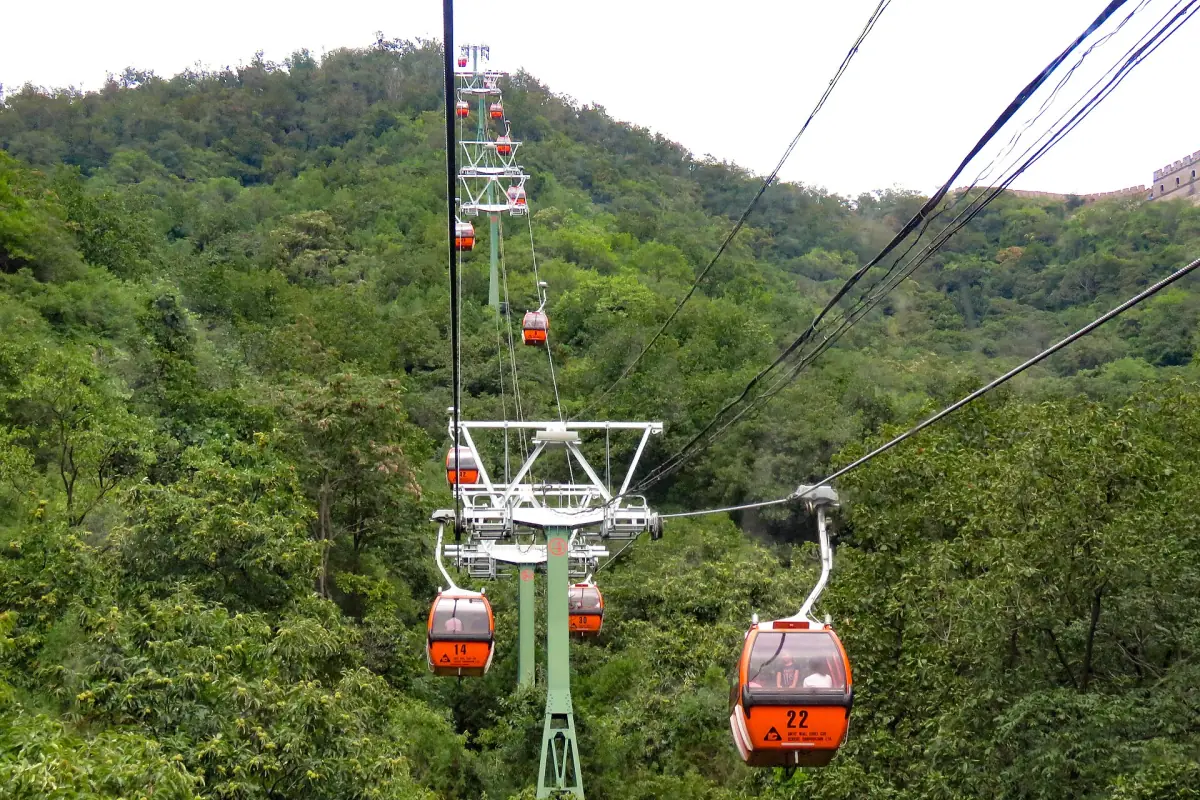 Cable car cabins above the forest at Mutianyu
